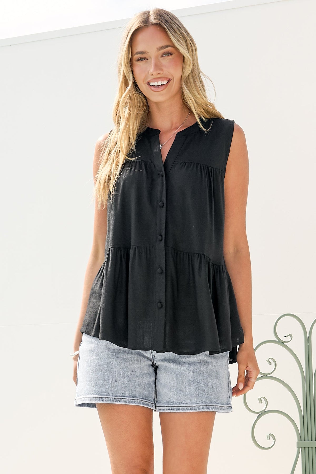 Ariana Top - High Neckline Sleeveless Tiered Button Down in Black
